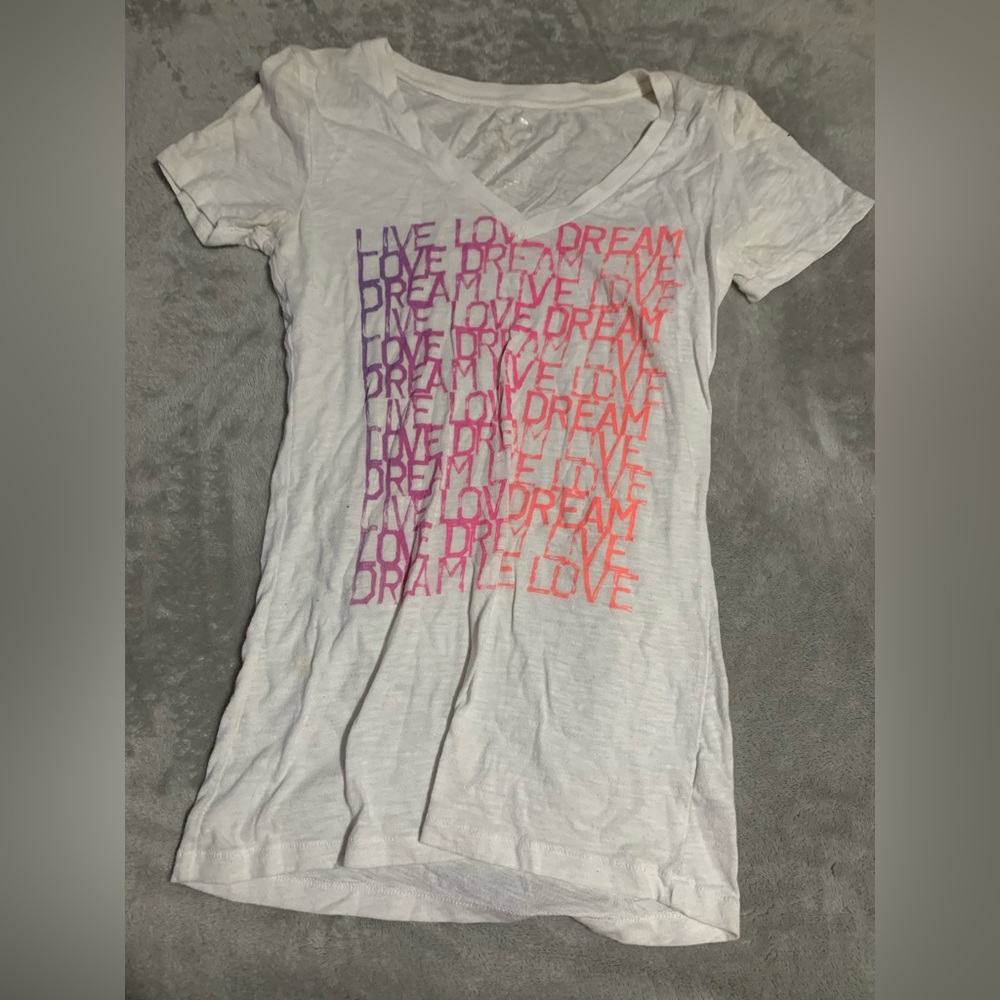 Multiple t shirts and tank tops